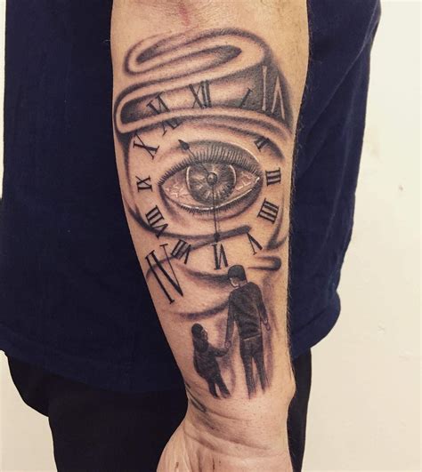 A Mans Arm With An All Seeing Eye Tattoo On It
