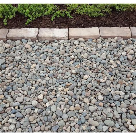 The natural stone mulch will help retain moisture in the soil and help prevent erosion. Classic Stone 10 cu. ft. Super Sack Large River Rock ...