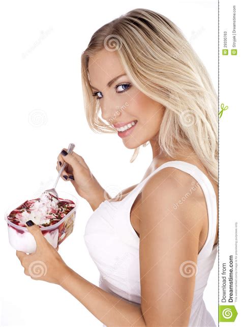 Beautiful Blonde Enjoying A Delicious Dessert Stock Image