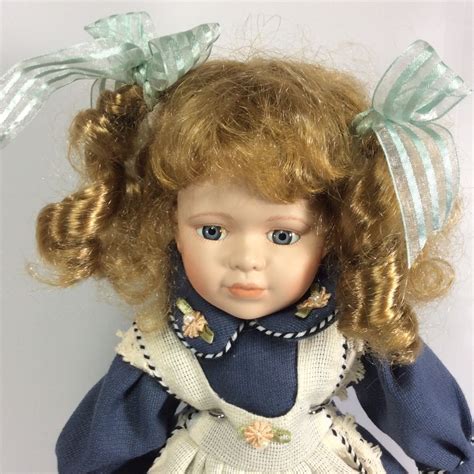 Porcelain Doll Blue Eyes Blonde Hair Blue Dress White Apron 16 Inches