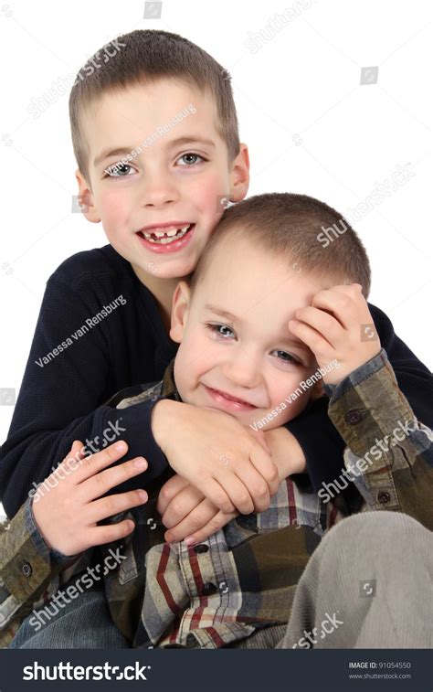 Two Young Brothers Against White Background Stock Photo 91054550