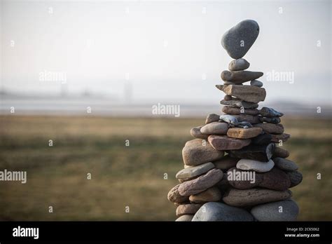 A Tower Of Stones Of Various Sizes Stacked In A Cairn The Top Stone