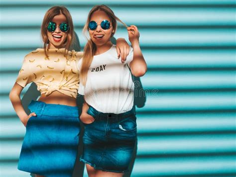 Two Young Beautiful Hipster Girls In Trendy Clothes In Studio Stock