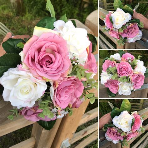 A Wedding Bouquet Featuring Silk White And Dusky Pink Roses And Foliage