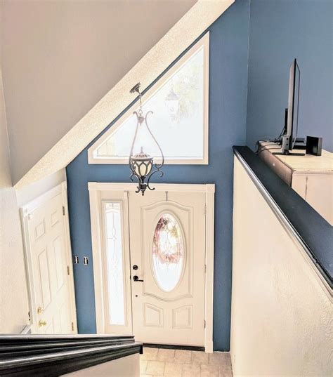 Beautiful Blue Accent Wall In This Lovely Split Level Entryway Blue Accent Walls Accent Wall