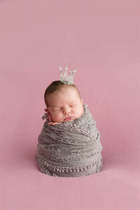 Sleeping Newborn Girl On A Pink Background Little Princess With Crown