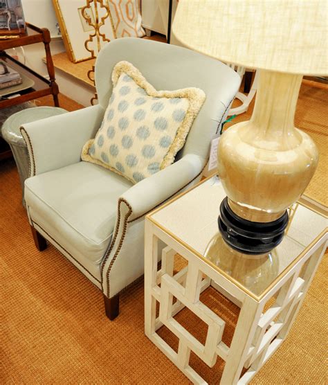 Polka dots are among the most versatile designs. Polka dot pillow on a blue armchair with nailhead trim as ...