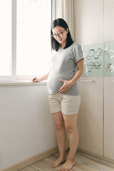 portrait of chinese pregnant woman by stocksy contributor maahoo stocksy