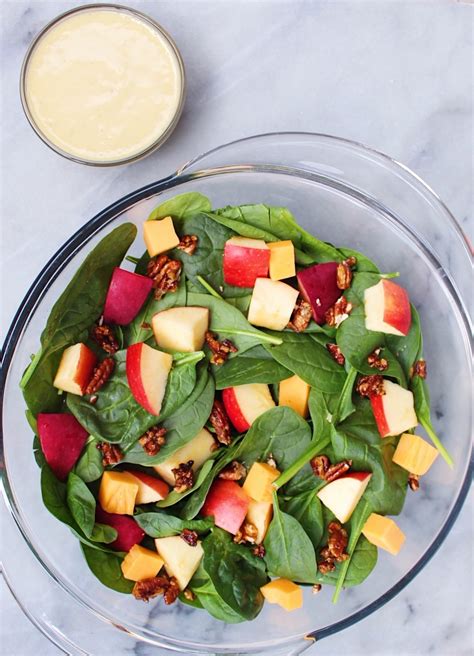 Itâ€™s made with a delicious mix of sweet and savory ingredients, itâ€™s tossed with a tangy champagne vinaigrette, and itâ€™s always a crowd favorite! Two Apple Spinach Salad with Aged Cheddar and Candied Pecans