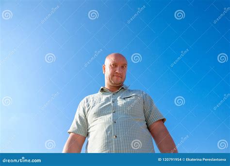 Portrait Of A Man Against A Blue Sky Stock Photo Image Of Folded