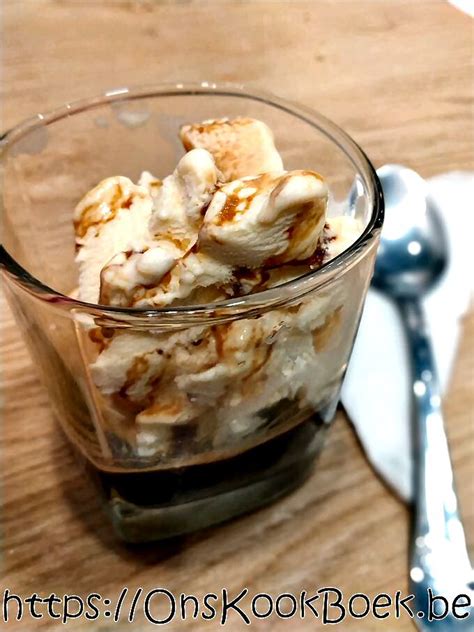 A Glass Bowl Filled With Food Sitting On Top Of A Wooden Table Next To