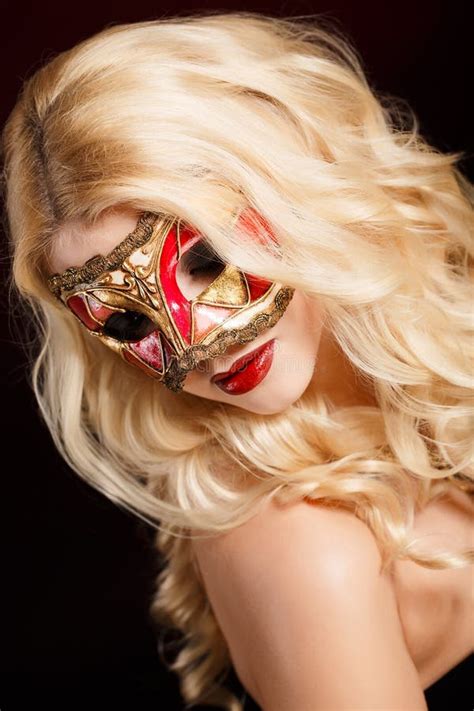 Portrait Of A Beautiful Young Blond Woman With Theatrical Mask On His