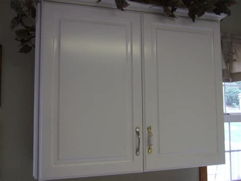 Remove the cabinet doors using a screwdriver to be able to work more effectively. How To Refinish White Melamine Cabinets | Cabinets Matttroy