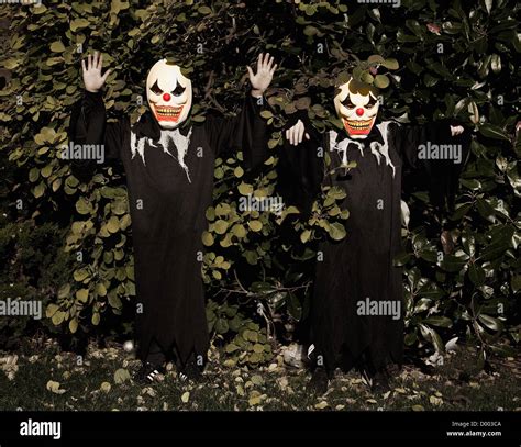 Halloween Scary Clowns In Tree Costumes Stock Photo Alamy
