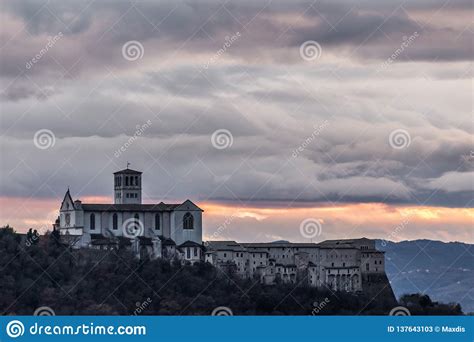 beautiful view of st francis church in assisi town umbria italy from an unusual place at sunset