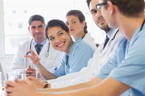 Smiling Nurse Looking At Colleagues Stock Image Image Of Focus Nurse