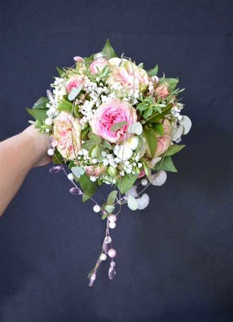 A Wired Bouquet Of Spray Roses And Gypsophila With Bead Decoration