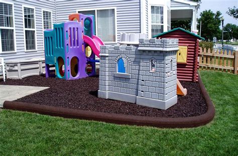 Place stakes in the ground to outline the space you want to enclose with your playground border, taking care to leave room for adequate clearance around play structures. Rubber Timbers - Border For Rubber Mulch