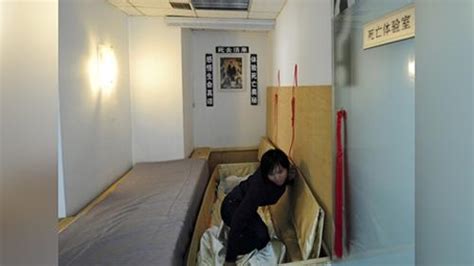 Patients Lie In Coffins To “die” As Part Of Chinese Psychological