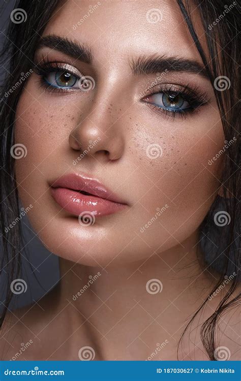 Beautiful Girl With Bright Fashionable Make Up Freckles And Blue Eyes