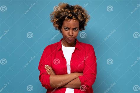 Angry Annoyed African Woman Keeping Arms Crossed And Staring At Camera