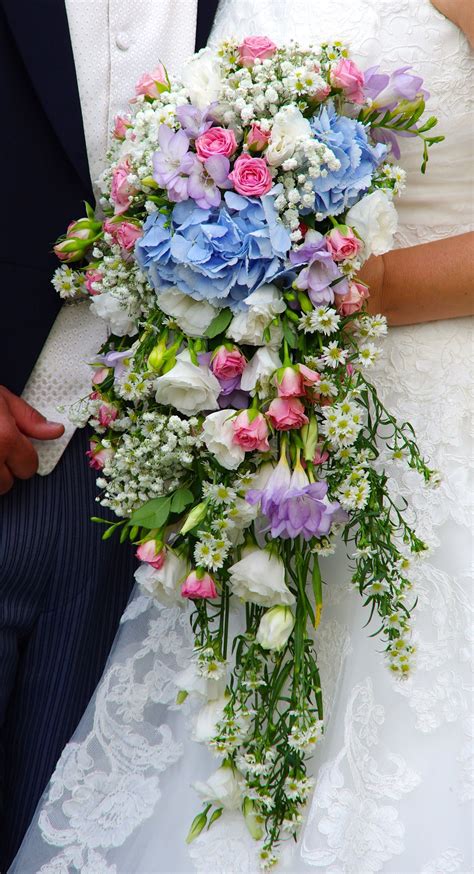 A Cascading Wedding Bouquet In Pastel Colours At Blake Hall Cascading