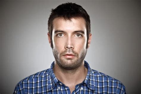Portrait Of A Normal Man Over Grey Background Stock Photo By