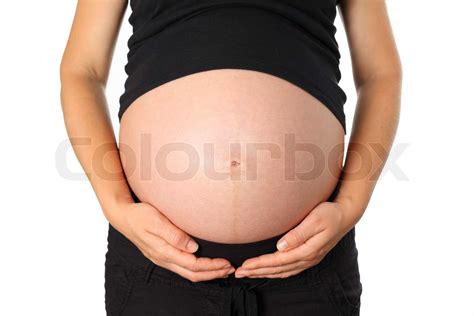 junge schwangere frau hält ihren bauch stock bild colourbox