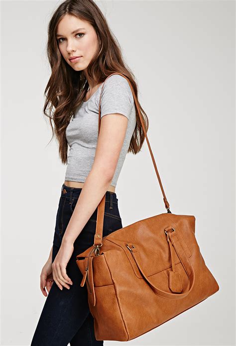 Lyst Forever 21 Faux Leather Weekender Bag In Brown