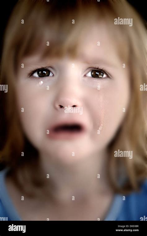 Portrait Of Little Girl Crying With Tears Rolling Down Her Cheeks Stock