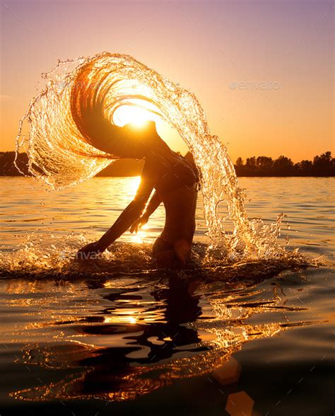 Beauty Model Girl Splashing Water With Her Hair Stock