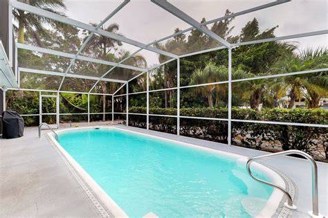Island discount tackle on anna maria island, florida. Canal-front home with private dock, covered lanai with ...