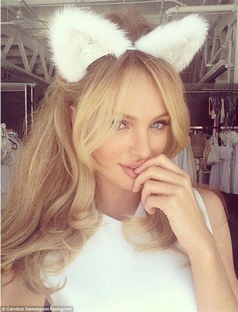 Candice Swanepoel Brings Out The Feline In A Pair Of Furry White Ears
