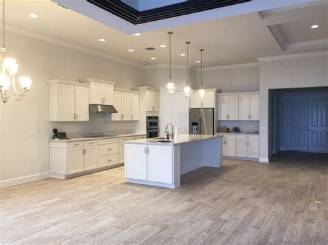 Maybe you would like to learn more about one of these? Off white shaker kitchen cabinets, quartz countertops ...