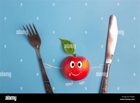 Apple Character With Knife And Fork Healthy Eating Concept Stock Photo
