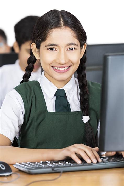 Indian Schoolgirl Student Using Computer Studying E Learning In Class