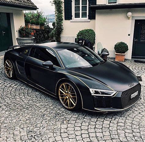 Luxurico® • — 🔥 Matte Black Audi R8 With Golden Rims And Stripes 🔥