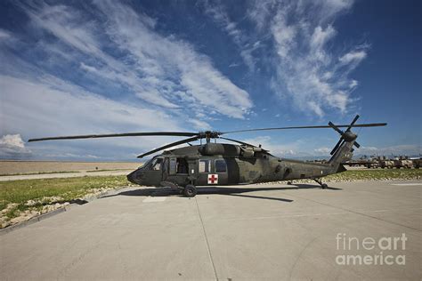 A Uh 60l Blackhawk Parked On Its Pad Photograph By Terry Moore Pixels