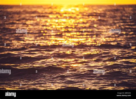 Sea Sunset Ocean Ripples Waves As Water Texture Background Stock Photo
