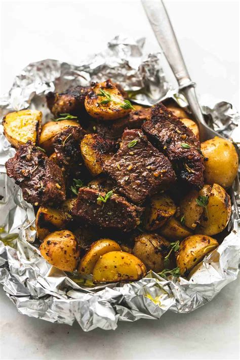 We cut the tenderloin in half crosswise for easier maneuvering and faster cooking, and we tent the pork with foil to hold in more heat while it's in the pan. Garlic Steak and Potato Foil Packs | Creme De La Crumb