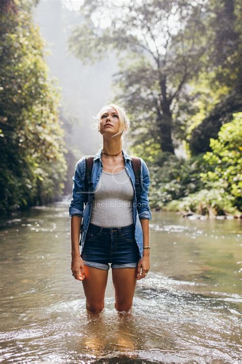 Attractive Young Hiker Standing In Wilderness Stream Jacob Lund