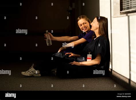 Two Nurses Sitting And Talking Stock Photo Alamy