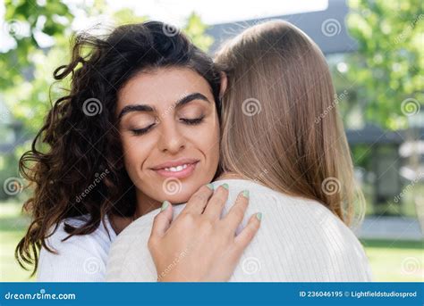 pleased and curly woman hugging girlfriend stock image image of homosexuality lgbt 236046195