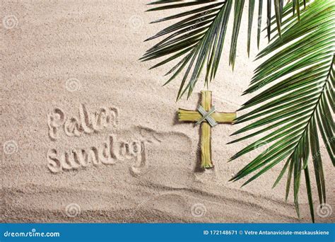 Cross And Palm Tree Leaves On Sand Palm Sunday Concept Top View Stock