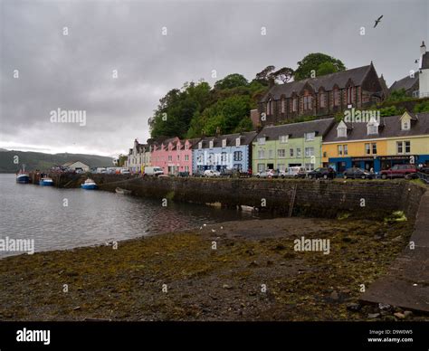 Colourful Houses And Shops On The Harbour At Portree Capital Of The