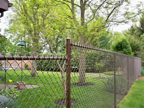 Chain link fences are made by creating a mesh out of wires that run vertically top to bottom. Vinyl-Coated Chain Link Fence Gallery | Phillips Outdoor ...