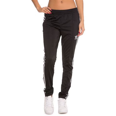 Phenomenal luxury selection, get it now with quick global shipping or click tailored to a tapered leg fit, this pair of black sst track pants from adidas originals are infused with modern streetwear appeal. Women's SST Track Pants BLACK