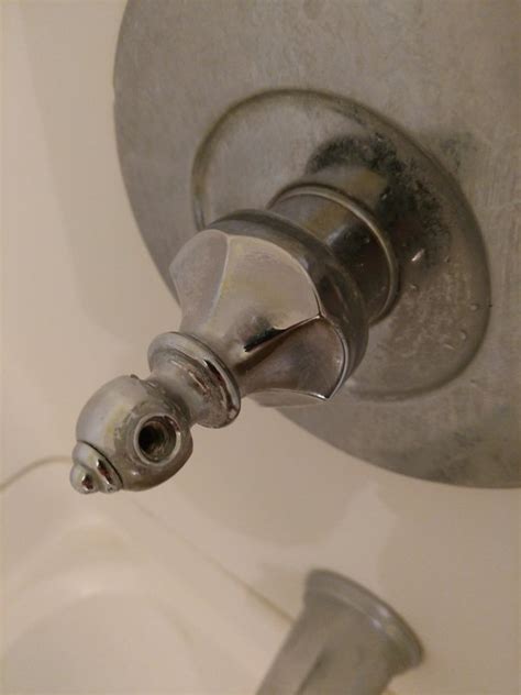 You can do this easily with a thin, flat screwdriver. How to remove shower facet handle - no set screw | Terry ...
