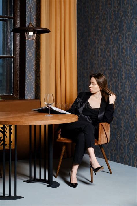 Gorgeous Woman In Pantsuit Sitting Behind Empty Table In Cafe Stock Image Image Of Pantsuit
