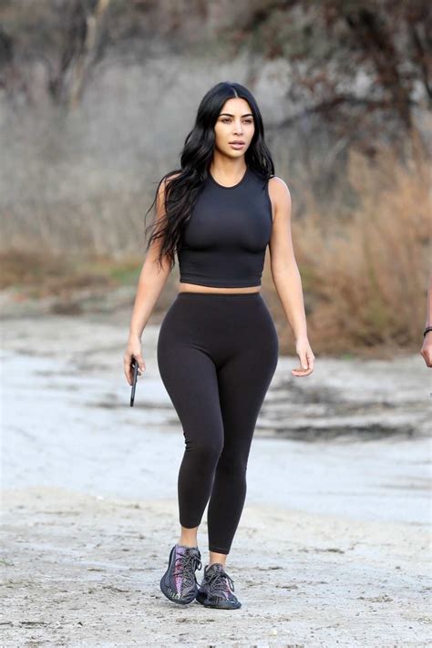 kim kardashian sports a black crop top and leggings as she steps out
